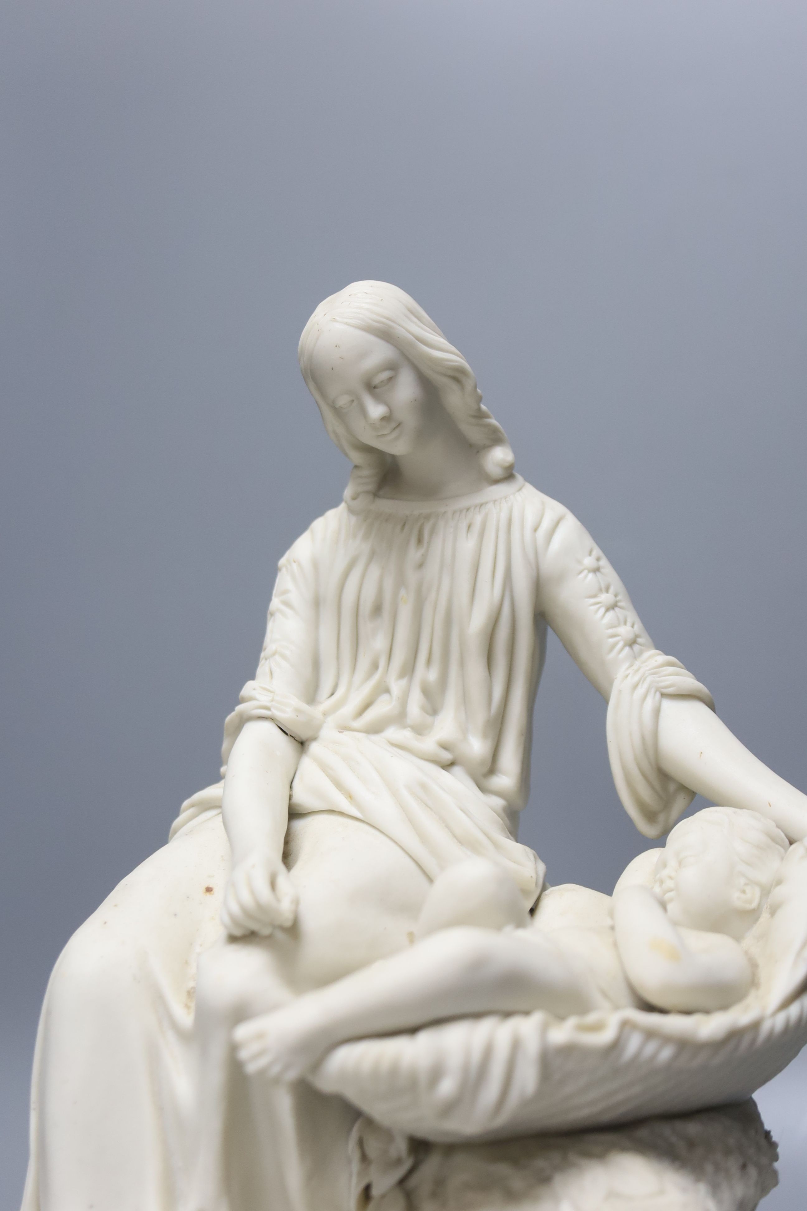 A Parian mother and child group, height 29cm